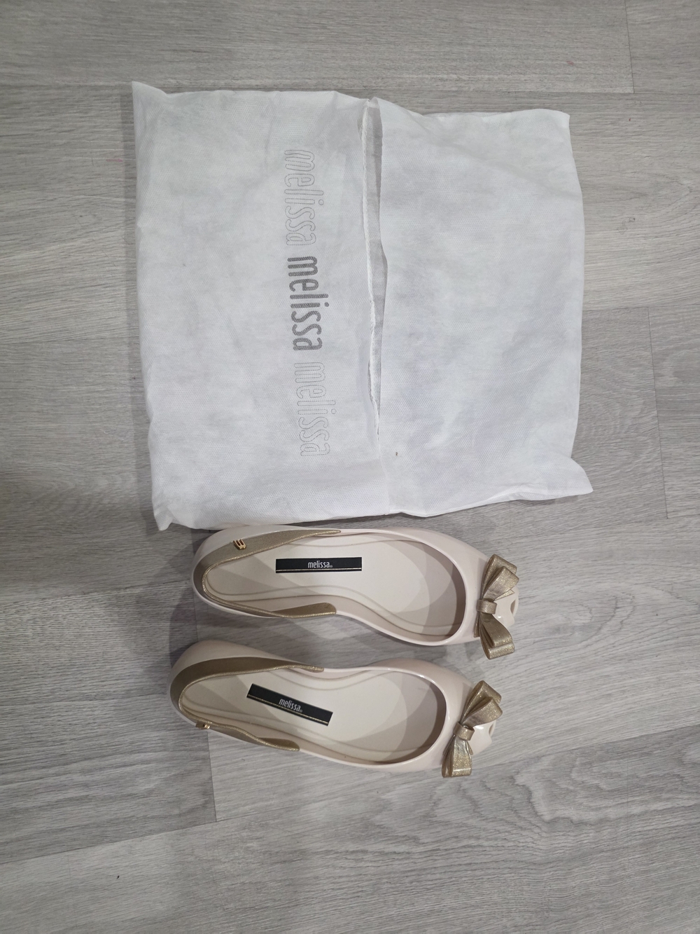 Melissa Beige Ballet Flats with Gold Bow Accent